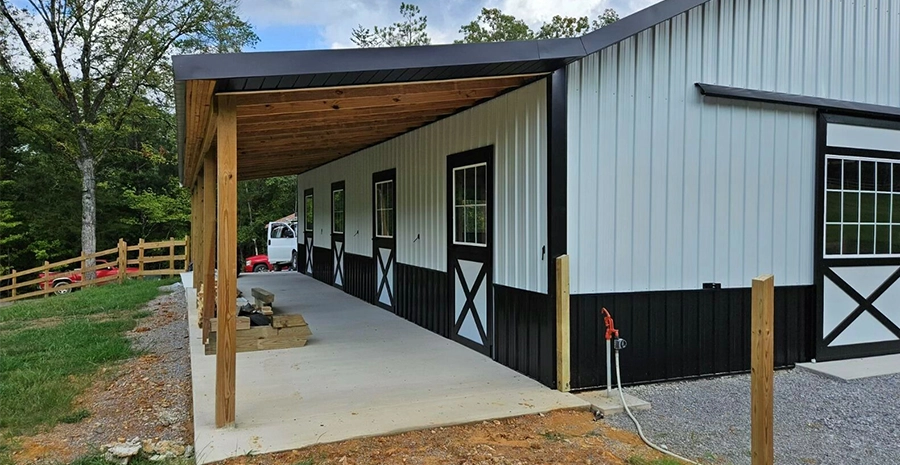 Tan metal barn with overhang